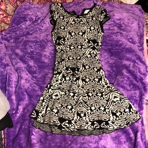 Black and white dress . 60% cotton 40% rayon .